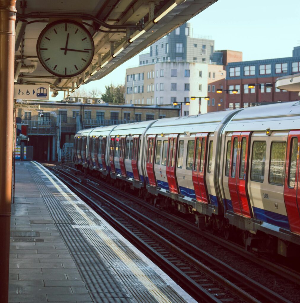 pexels photo 297836 297836 A city train station with a train on the tracks during sunrise. Ideal for urban and transportation themes.